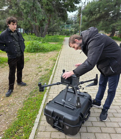 Preparing a drone on its case for a field test