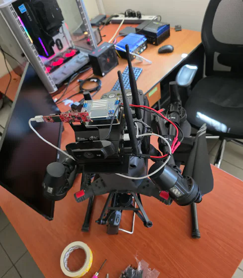 Drone with radios and sensors on a lab bench
